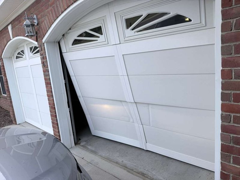 Off-Track Garage Door Repair by Emerald of Merchants